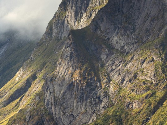 Aotearoa's Dramatic Beauty: Where Clouds Kiss the Cliffs - A Sight to Behold
