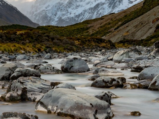 Escape to Tranquility: Discovering the Magic of Mountain Streams & Snow-Capped Peaks